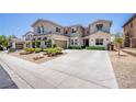 Charming stucco home featuring a well-maintained lawn and attached garage at 7445 Mezzanine View Ave, Las Vegas, NV 89178