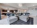 Expansive living room featuring a large sectional sofa, open floor plan, and modern decor at 746 Horizon Canyon Dr, Henderson, NV 89052