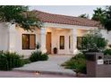 Inviting front porch with white columns and manicured landscaping at 7745 Radcliff St, Las Vegas, NV 89123