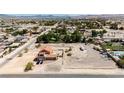 Aerial view showcasing a property featuring a large lot, pool, and the surrounding neighborhood at 8335 Rancho Destino Rd, Las Vegas, NV 89123