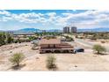 Aerial view showcasing the exterior of a two-story house with desert landscaping at 8335 Rancho Destino Rd, Las Vegas, NV 89123