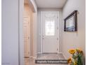 Bright foyer showcasing a decorative glass door and neutral tile flooring at 10470 Irish Cliffs Ct, Las Vegas, NV 89149