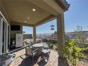 Relaxing covered patio with comfortable seating, ideal for enjoying outdoor meals with scenic vistas at 146 Cabo Cruces Dr, Henderson, NV 89011