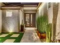 Modern front door with glass panels and sleek hardware at 1509 Winslow St, Las Vegas, NV 89117
