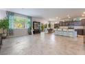 Spacious living area with tile flooring, large windows and plenty of natural light at 151 Duckhook Ave, Las Vegas, NV 89148