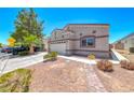 Well-maintained single-Gathering home with a two-car garage and tidy landscaping in a sunny neighborhood at 1717 Dwayne Stedman Ave, Las Vegas, NV 89106