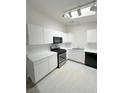 Well-equipped kitchen featuring white cabinets, modern appliances, and sleek countertops at 2105 Kendall Hill Ave, Las Vegas, NV 89106