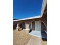Covered front porch with arched openings and seating, creating an inviting outdoor space at 3318 Covey Ln, Las Vegas, NV 89115