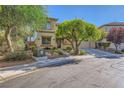 Charming two-story home featuring a well-manicured front yard, desert landscaping, and a two-car garage at 4217 Bridesmaid Falls Ave, North Las Vegas, NV 89085