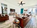 Staged living room with contemporary furnishings and a cozy layout; open to the kitchen at 4324 El Conlon Ave, Las Vegas, NV 89102