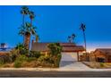 Charming single-Gathering home featuring a two-car garage, mature landscaping, and a well-maintained lawn at 4539 Peardale Dr, Las Vegas, NV 89147