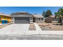 Charming single-story home with a well-maintained front yard, a two-car garage, and a neutral-toned exterior at 5742 Forsythe Dr, Las Vegas, NV 89142