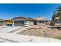 Attractive one-story home featuring a two-car garage, desert landscaping, and a neutral color scheme at 5742 Forsythe Dr, Las Vegas, NV 89142