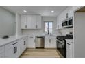 Modern kitchen showcasing sleek white cabinetry, stainless steel appliances, and a stylish countertop at 5742 Forsythe Dr, Las Vegas, NV 89142
