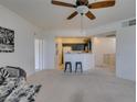 Open-concept living space featuring a ceiling fan and an open view to the kitchen with breakfast bar at 5855 Valley Dr # 2092, North Las Vegas, NV 89031
