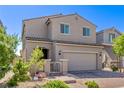 Attractive two-story home with a neutral exterior, a brick driveway, and a welcoming front entrance at 6313 Voss St, North Las Vegas, NV 89081