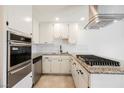 Updated kitchen featuring stainless steel appliances, granite countertops, and white cabinetry at 6330 Spring Meadow Dr, Las Vegas, NV 89103