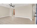 Spacious, light-filled living room featuring hardwood floors and a modern ceiling fan at 636 Burton St, Henderson, NV 89015