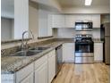 Updated kitchen with stainless steel appliances and granite countertops at 6800 E Lake Mead Blvd # 2072, Las Vegas, NV 89156