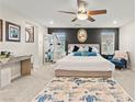 Inviting bedroom featuring a plush bed, stylish decor, and ample natural light at 7502 Lush Oasis Ave, Las Vegas, NV 89113