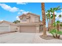 Charming two-story home featuring a tile roof, desert landscaping, and an attached two-car garage at 8379 Drop Camp St, Las Vegas, NV 89123