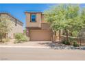 Charming two-story home with stucco exterior, two-car garage, and a well-maintained front yard at 920 Cirrus Cloud Ave, Las Vegas, NV 89138