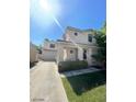Charming two-story home featuring a well-maintained lawn, covered porch, and convenient driveway leading to the attached garage at 9801 Bradford Summit St, Las Vegas, NV 89183
