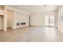 Spacious living room featuring tile floors, recessed lighting, and sliding glass doors at 105 Barkset Way, Henderson, NV 89011