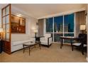 Comfortable living room with stylish decor, art, and large windows offering views of the city skyline at 135 E Harmon Ave # 809, Las Vegas, NV 89109