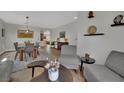 Open living space with dining area, plush seating and elegant decor throughout the home at 15 Imposing Knoll Ave, Henderson, NV 89002