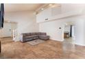 Inviting living area showcasing tile flooring, high ceilings, and staircase for easy access to the upper level at 309 Clifton Heights Dr, Las Vegas, NV 89145