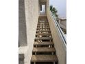 Exterior stairway with sturdy railings leading to upper-level units at 3425 E Russell Rd # 265, Las Vegas, NV 89120