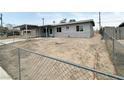 Newly renovated single-story house with xeriscaped front yard and chain-link fence at 4924 Carmen Blvd, Las Vegas, NV 89108