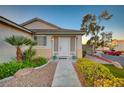 Inviting front entrance with lush landscaping, a charming walkway, and a welcoming front door with great curb appeal at 528 Lavina Ct, Las Vegas, NV 89123