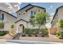 Charming home featuring a landscaped yard, attractive facade with blue shutters, and welcoming entrance at 10556 Sariah Skye Ave, Las Vegas, NV 89166