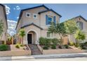 Beautiful home with manicured landscaping and a welcoming front entrance and lovely architectural details at 10556 Sariah Skye Ave, Las Vegas, NV 89166