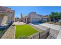 Charming home with a well-maintained lawn, complemented by an arched entrance and paved driveway at 116 Lotus Blossom Ct, Las Vegas, NV 89145