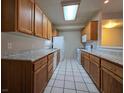Traditional kitchen with tile floor, ample counter space, and a full suite of appliances at 1739 N Lamont St, Las Vegas, NV 89115