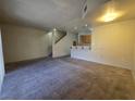 Open living room features modern carpet, and a breakfast bar to the left at 1739 N Lamont St, Las Vegas, NV 89115