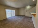 Spacious living room with large sliding glass doors and stairway to the second floor at 1739 N Lamont St, Las Vegas, NV 89115