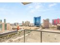 Wide city view from a balcony with many iconic hotels and resorts under a blue sky at 200 W Sahara Ave # 2204, Las Vegas, NV 89102