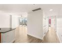 Open living space with light hardwood floors and large windows offering great city views at 200 W Sahara Ave # 2204, Las Vegas, NV 89102