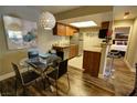 Bright dining area with modern table and chairs, adjacent to kitchen at 4200 S Valley View Blvd # 1035, Las Vegas, NV 89103