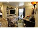 Inviting living room featuring stylish seating, glass tables, and outdoor access at 4200 S Valley View Blvd # 1035, Las Vegas, NV 89103