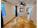 Open living area with unique tile flooring and bright windows, creating a warm and inviting space at 5361 Candlespice Way, Las Vegas, NV 89135