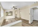 Open-concept living room with modern flooring, neutral paint, and ample natural light at 6035 Shadow Oak Dr, North Las Vegas, NV 89031