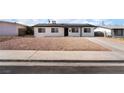 Charming single-story home with solar panels, minimalist desert landscaping, and a welcoming entrance at 6444 Bannock Way, Las Vegas, NV 89107