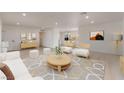 Spacious living room with stylish furnishings open to dining area at 6444 Bannock Way, Las Vegas, NV 89107