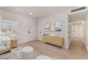 Bright living room featuring modern decor and light wood flooring at 6444 Bannock Way, Las Vegas, NV 89107
