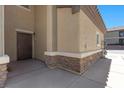 Welcoming exterior entrance features stone accents, covered entry, and easy access to the home at 6868 Sky Pointe Dr # 2035, Las Vegas, NV 89131